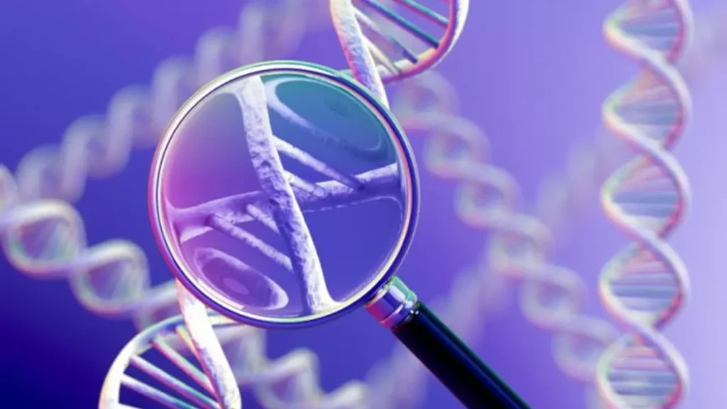 A magnifying glass over a DNA structure highlighting the mystery of cancer's rise.