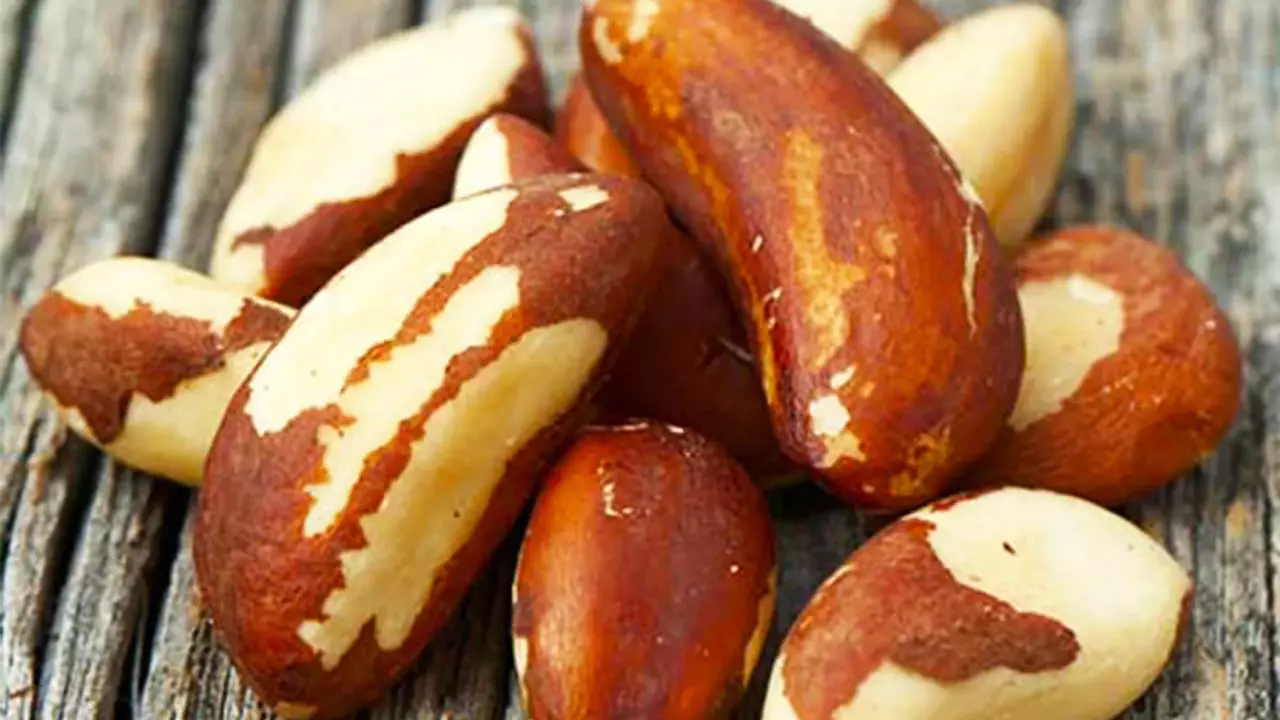 Brazil nuts scattered on a rustic background