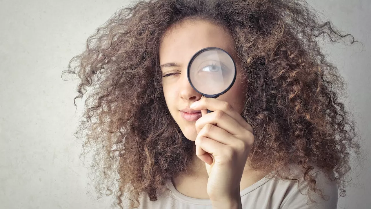 A magnifying glass over a feedback form, symbolizing scrutiny and understanding.