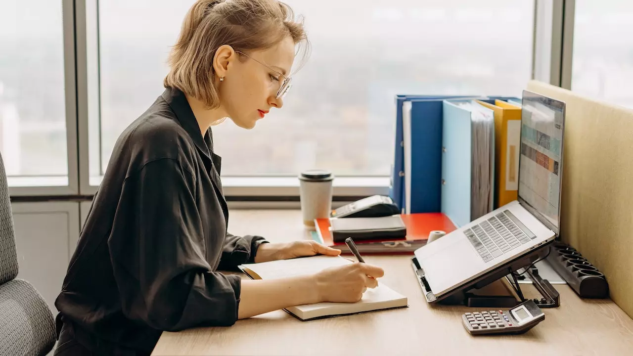 A tidy and organized workspace with a laptop, illustrating a distraction-free work environment.